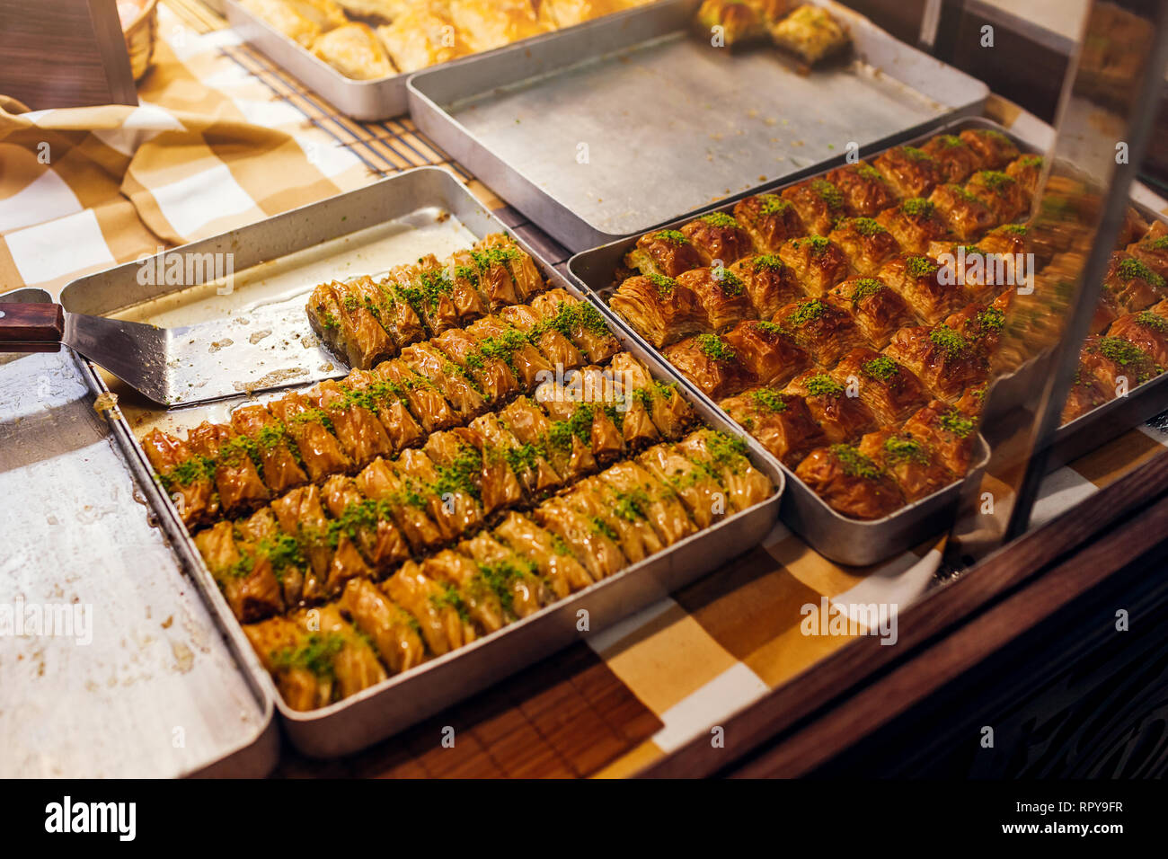 Assortment Of Turkish Baklava With Pistachio On Cafe Showcase
