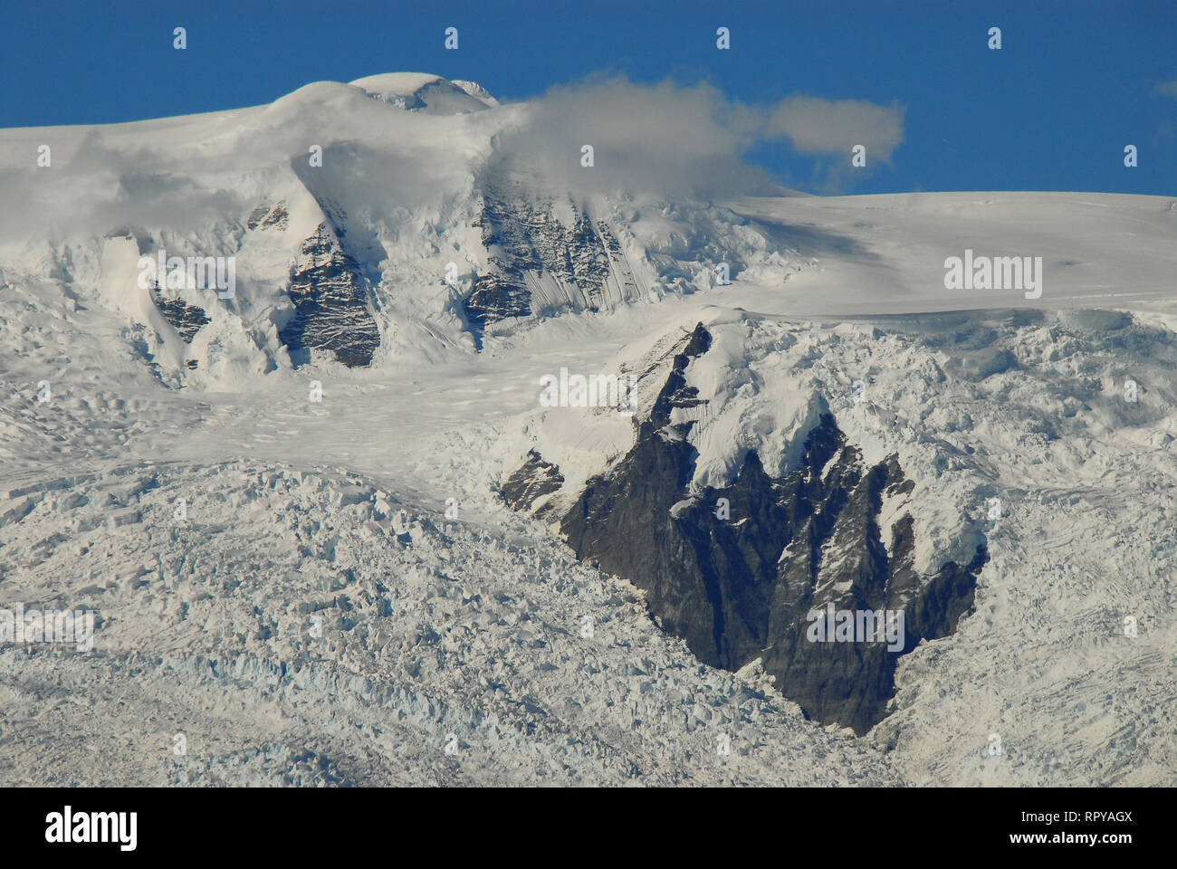 Snow covered mountain tops, which are well over 15,000 feet high, in the Wrangell St. Elias National Park, Alaska, USA. Stock Photo
