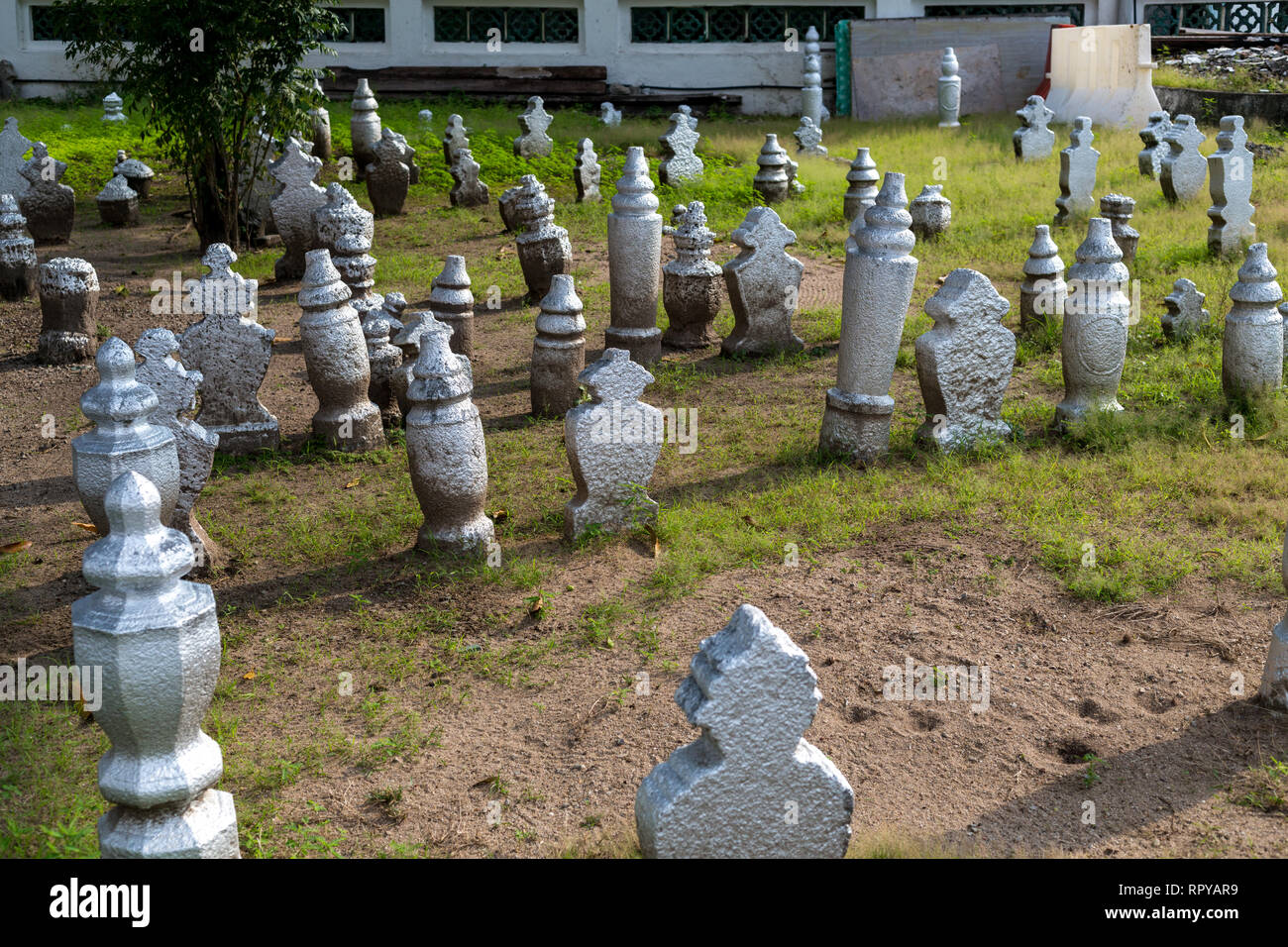 Gravestones in Cemetery of Kampung Kling Mosque, Melaka, Malaysia.  Round for men, shaped for women. Stock Photo