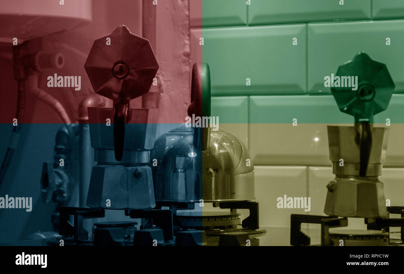 Two moka pots and a steel teapot on a gas stove idle, with four color