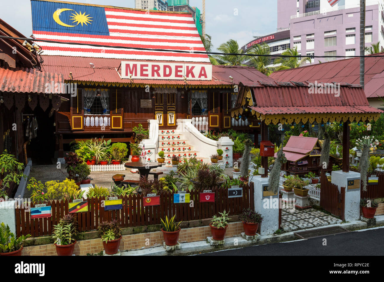 Kampung Morten House with Flags Representing Traditional Malaysian Sultanates, Melaka, Malaysia. Stock Photo