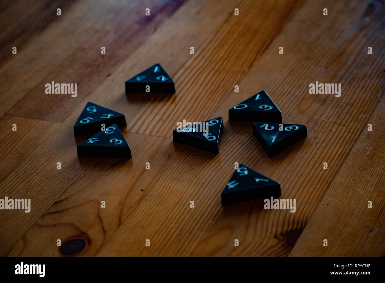 Board games pieces scattered across wood grain table Stock Photo Alamy