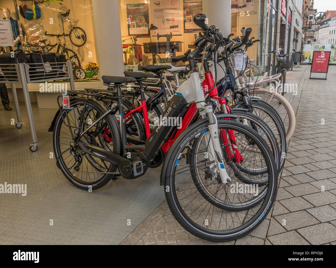 Electric bicycles for sale outsifde shop. Oldenburg. Lower Saxony. Germany  Stock Photo - Alamy