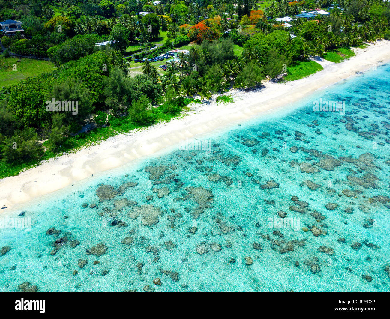 An aerial view of Black Rock Beach at Rarotonga in the Cook Islands with blue water Stock Photo