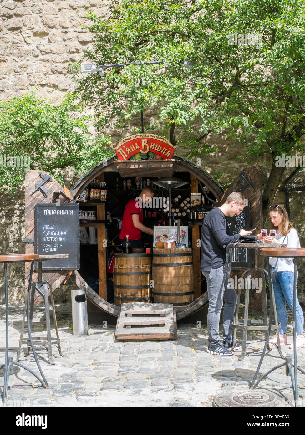 A bar selling cherry liquor in the old town of Lviv, Ukraine. Lviv's well preserved architecture, which blends Central and Eastern European styles, an Stock Photo