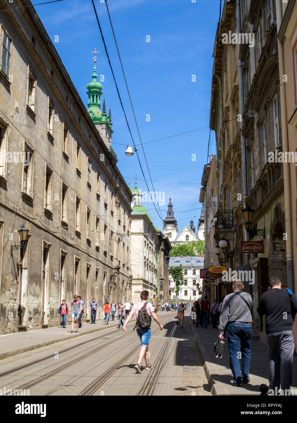 A street in the old town of Lviv, in Ukraine. Its well preserved architecture, which blends Central and Eastern European styles, and cheap prices, mak Stock Photo