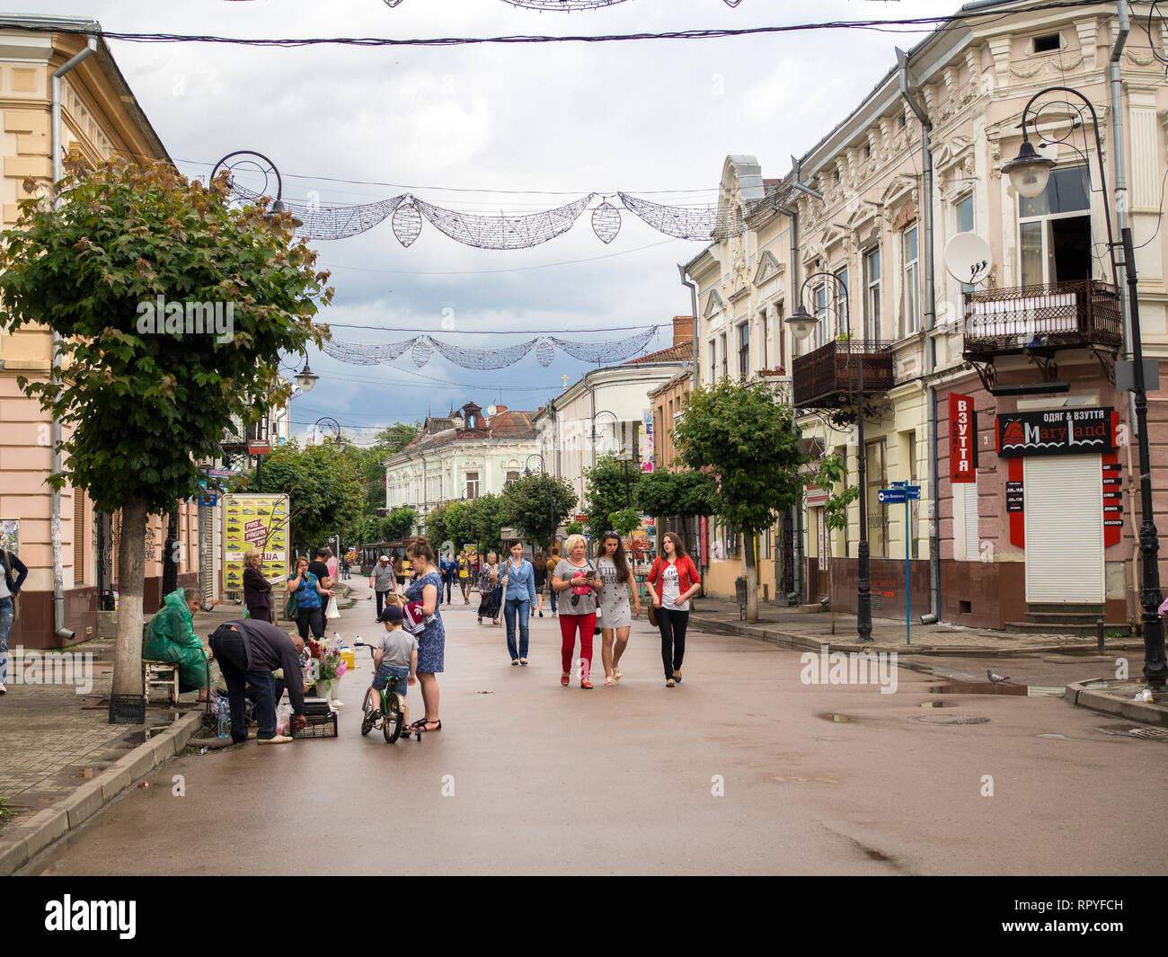 Pedestrians in the old town of Kolomyia, in Ukraine. Stock Photo