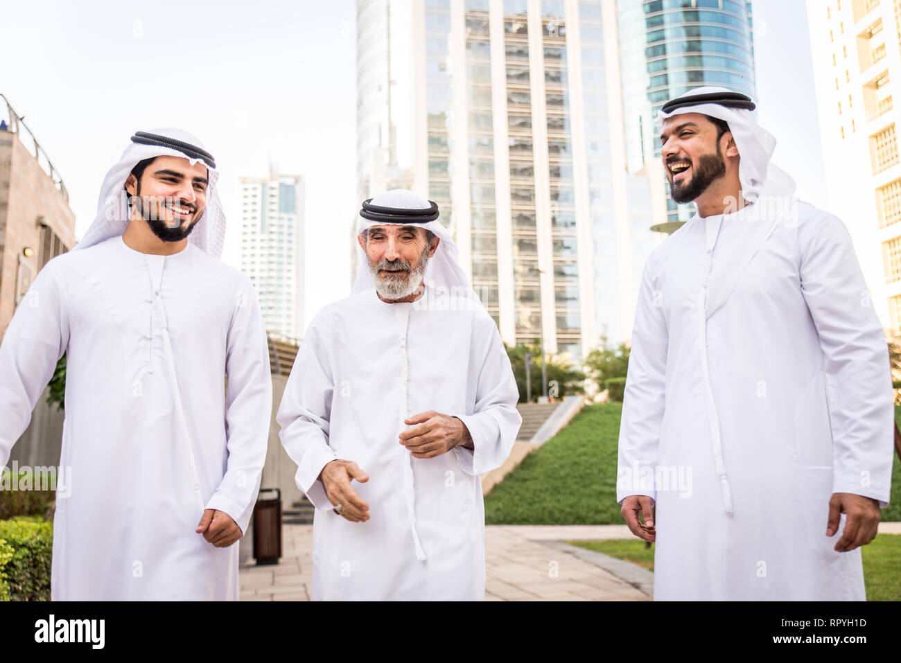 Group of arabian businessmen with kandura meeting outdoors in UAE ...