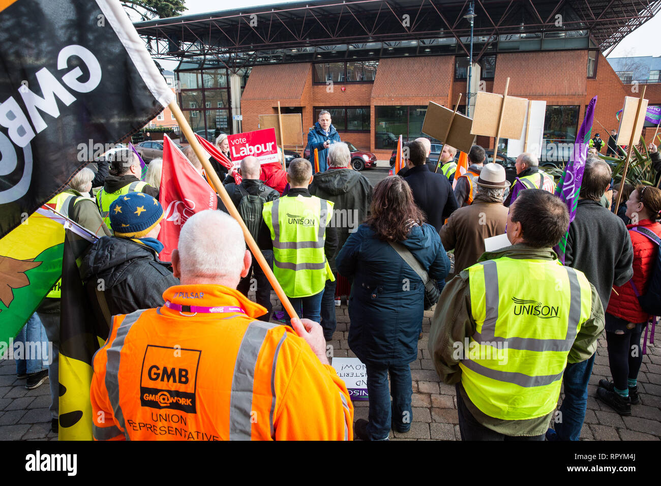 Maidenhead, Berkshire, UK. 23rd February, 2019. Matt Rodda, Labour MP for Reading East, addresses members of the Windsor and Maidenhead branches of the Labour Party and UNISON and GMB trade unions at a protest outside Maidenhead Town Hall in Prime Minister Theresa May's constituency against planned spending cuts of £6.8m to the 2019/2020 budget by the Royal Borough of Windsor and Maidenhead. Over 1,000 people had signed a petition to the council demanding an alternative to the cuts. Credit: Mark Kerrison/Alamy Live News Stock Photo