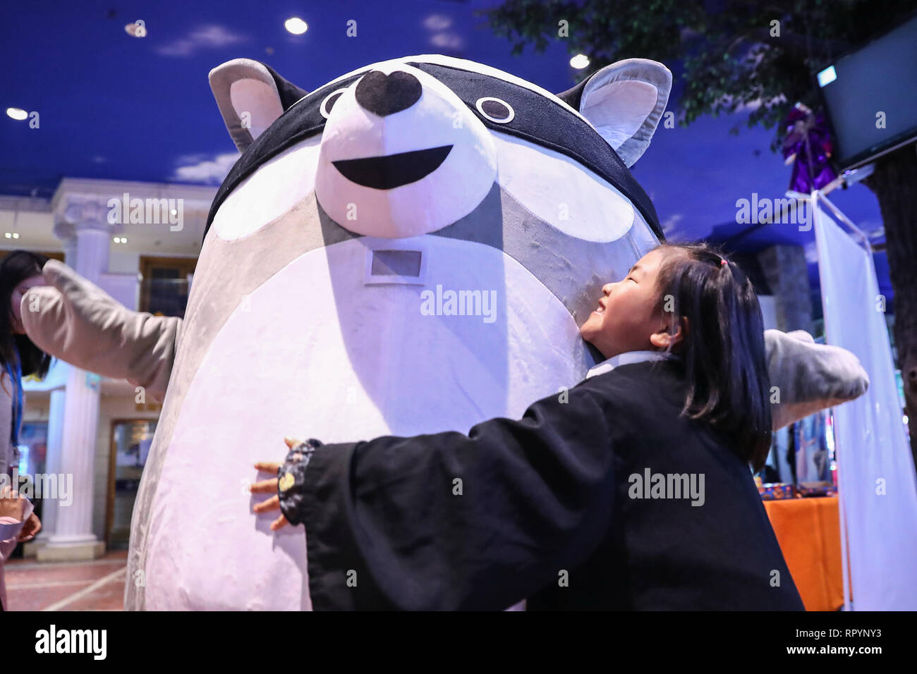 (190223) -- BEIJING, Feb. 23, 2019 (Xinhua) -- A girl hugs a Rare Bear, a cartoon figure for raising public awareness of rare diseases, in Beijing, capital of China, Feb. 23, 2019. The 12th International Rare Disease Day falls on Feb. 28, 2019 with the theme of 'Bridging health and social care'. (Xinhua/Zhang Yuwei) Stock Photo