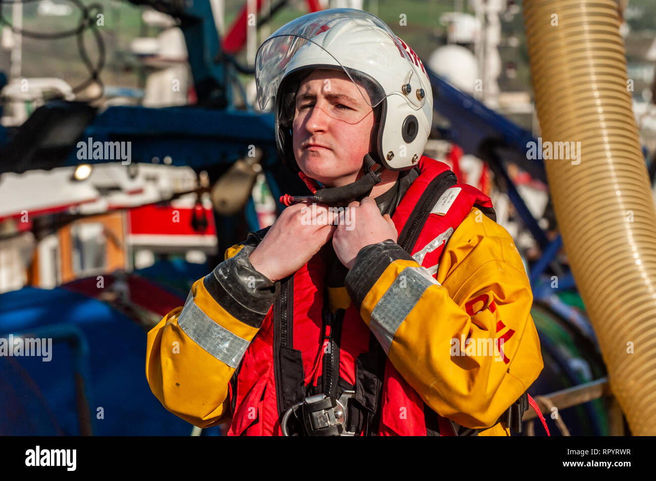 Union Hall, West Cork, Ireland. 23rd Feb, 2019. An RNLI Lifeboat crew member prepares to participate in a man overboard demonstration for the general public. The Union Hall lifeboat was called out 10 times in 2018 and once so far this year. Credit: Andy Gibson/Alamy Live News. Stock Photo