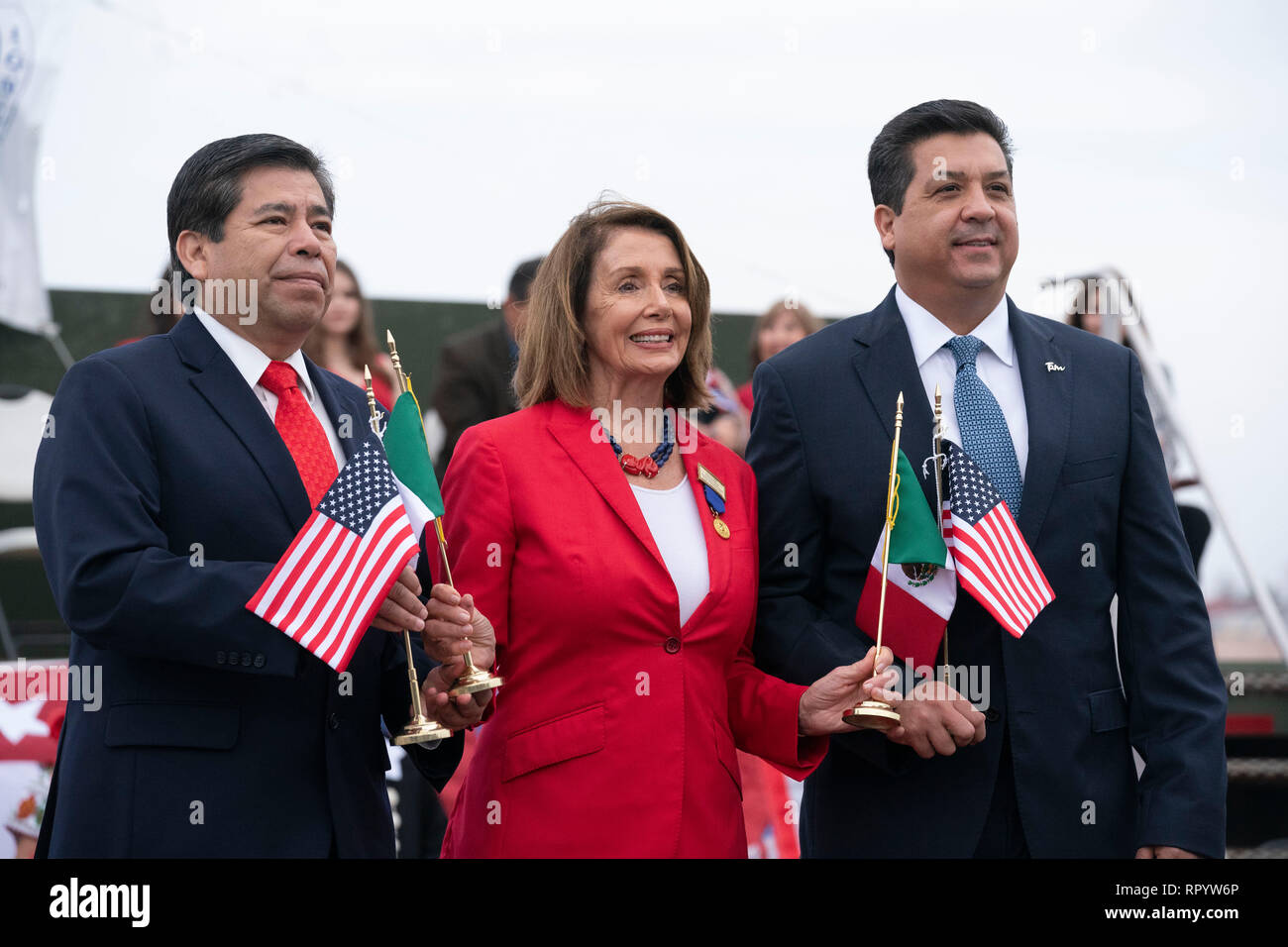 United States House of Representatives Speaker Nancy Pelosi, with National Institute of Migration commissioner Dr. Tonatiuh Guillen Lopez (red tie) and Francisco Javier Garcia Cabeza de Vaca (blue tie), governor of the Mexican state of Tamaulipas, participate in the abrazo (friendship) ceremony on the Juarez Lincoln international bridge between Laredo, Texas, and Nuevo Laredo in Tamaulipas during Laredo's annual Washington's Birthday celebration. Stock Photo