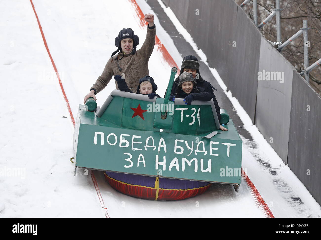 Moscow, Russia. 23rd Feb, 2019. MOSCOW, RUSSIA - FEBRUARY 23, 2019: Participants ride the sledge they have designed for the Battle Sani creative sledge festival in Moscow. Artyom Geodakyan/TASS Credit: ITAR-TASS News Agency/Alamy Live News Stock Photo