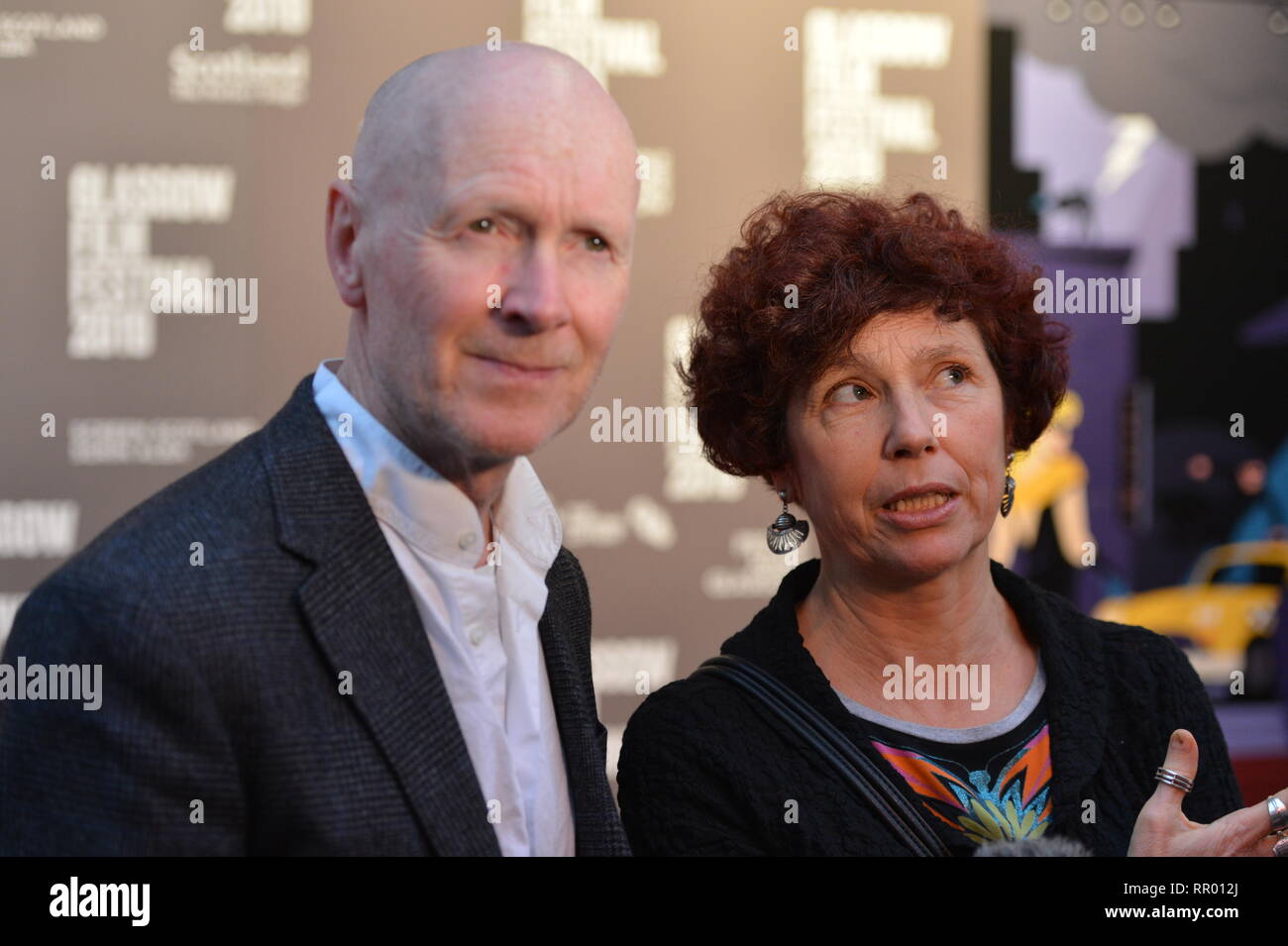 Glasgow, UK. 23 February 2019.  Red Carpet at the Glasgow Film Theatre for the Scottish Premier of the film, Yuli.  Directed by Iciar Bollain (right) and written by Paul Laverty (left), starring actor, Carlos Acosta. Credit: Colin Fisher/Alamy Live News Stock Photo
