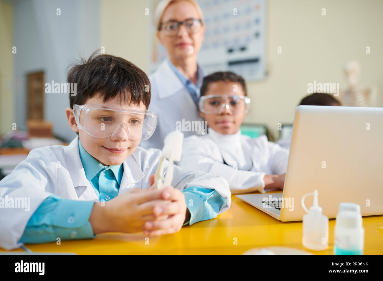 Boy at chemistry lesson Stock Photo