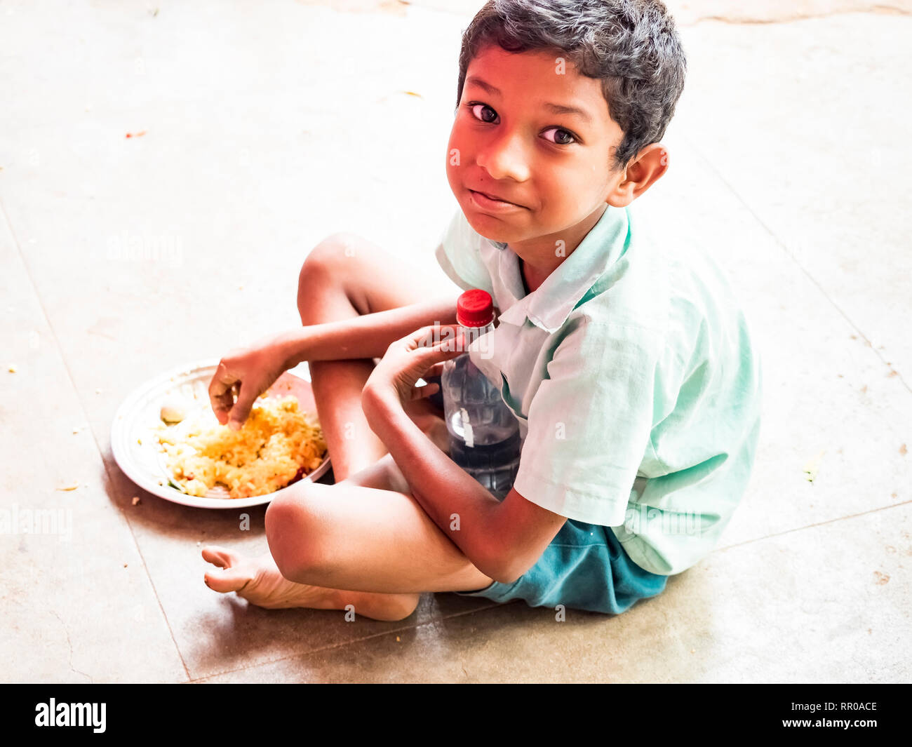 Indian child eating rice hires stock photography and images Alamy