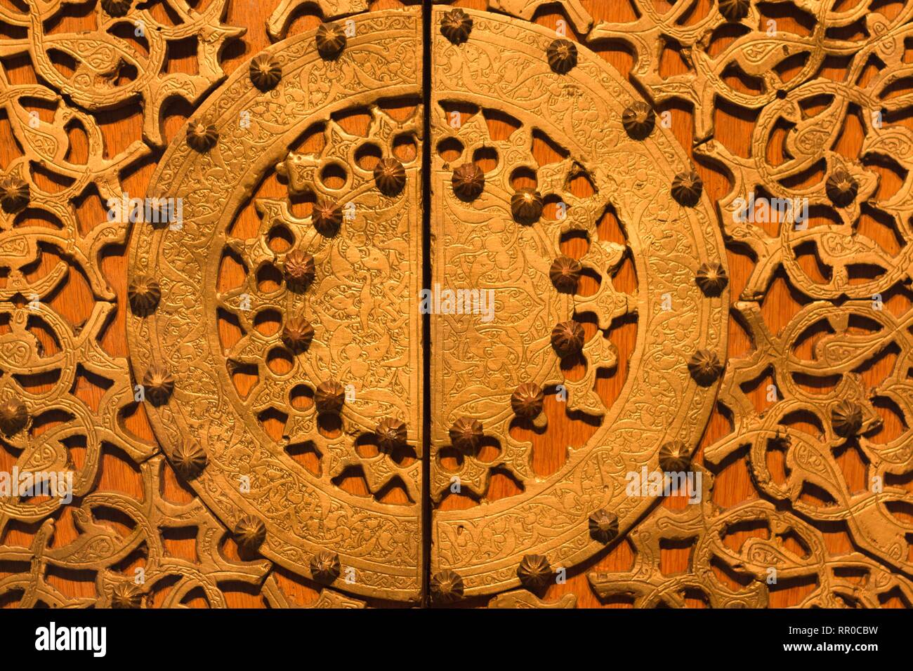 Beautiful ornament made of precious materials. The ornament is made on the wooden surface of which for many years. Stock Photo