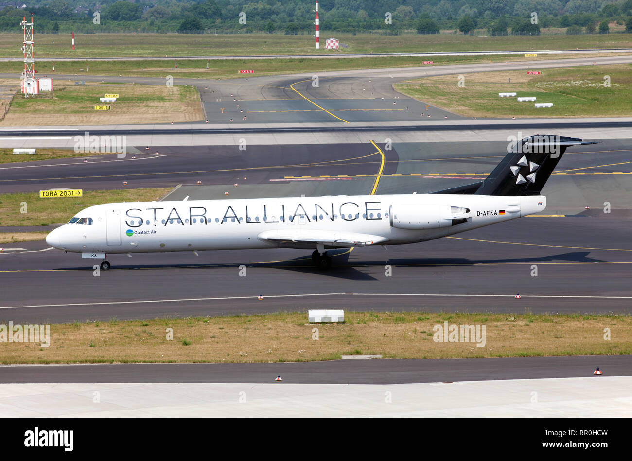 Passenger aircraft Fokker 100 of Contact Air airline is part of the Lufthansa Regional airlines makes a run before takeoff Stock Photo