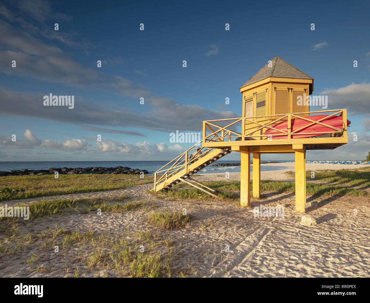 A bright yellow lifeguard station on  Needham's Point near Bridgetown in Barbados, Caribbean. Stock Photo