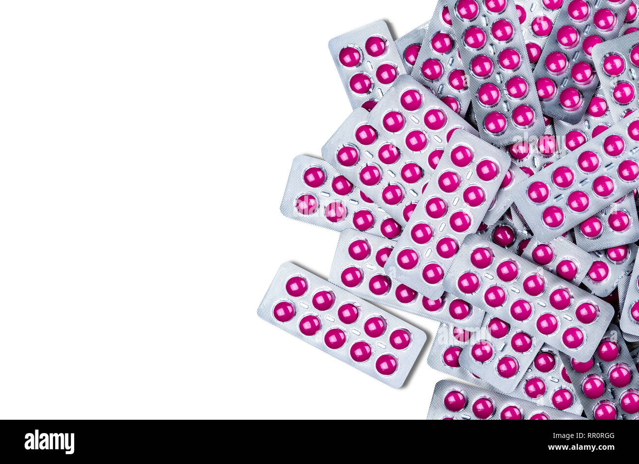 Ibuprofen in pink tablet pills in blister pack isolated on white