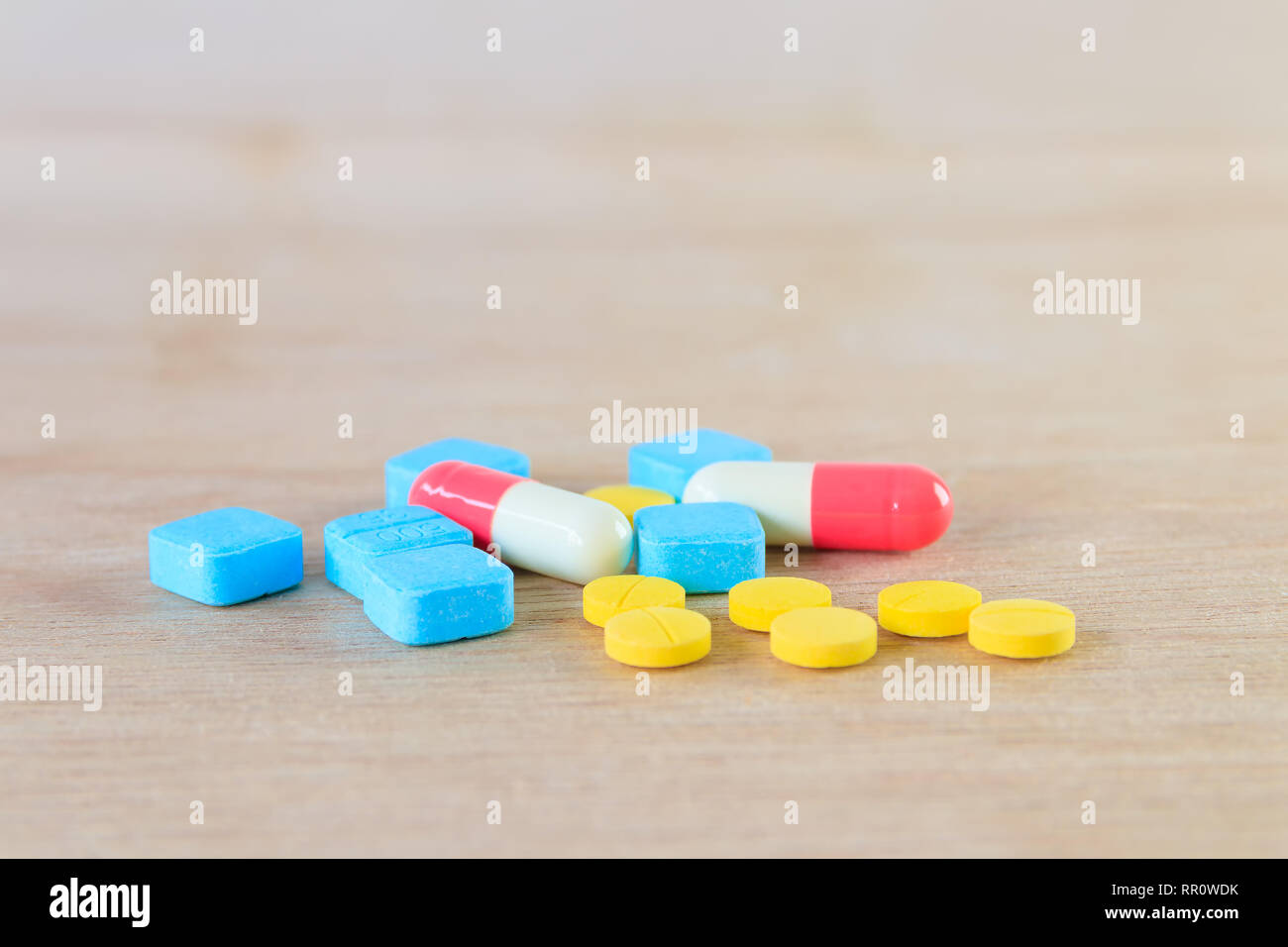 Pills And Capsule On Wooden Floor With Copy Space Add Text High