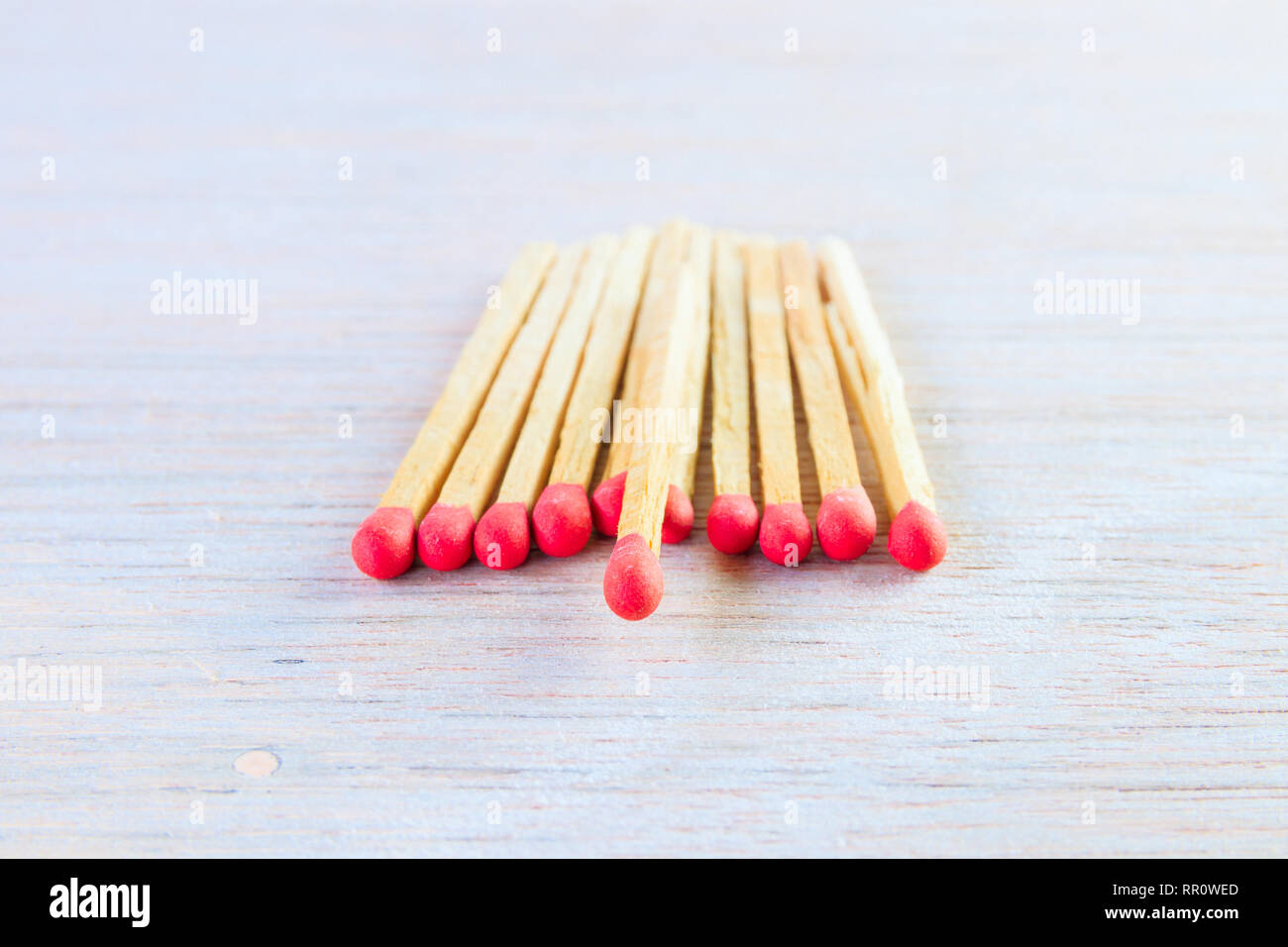 Red Head Stack match stalk with red head concept energy old vintage on wooden floor ...