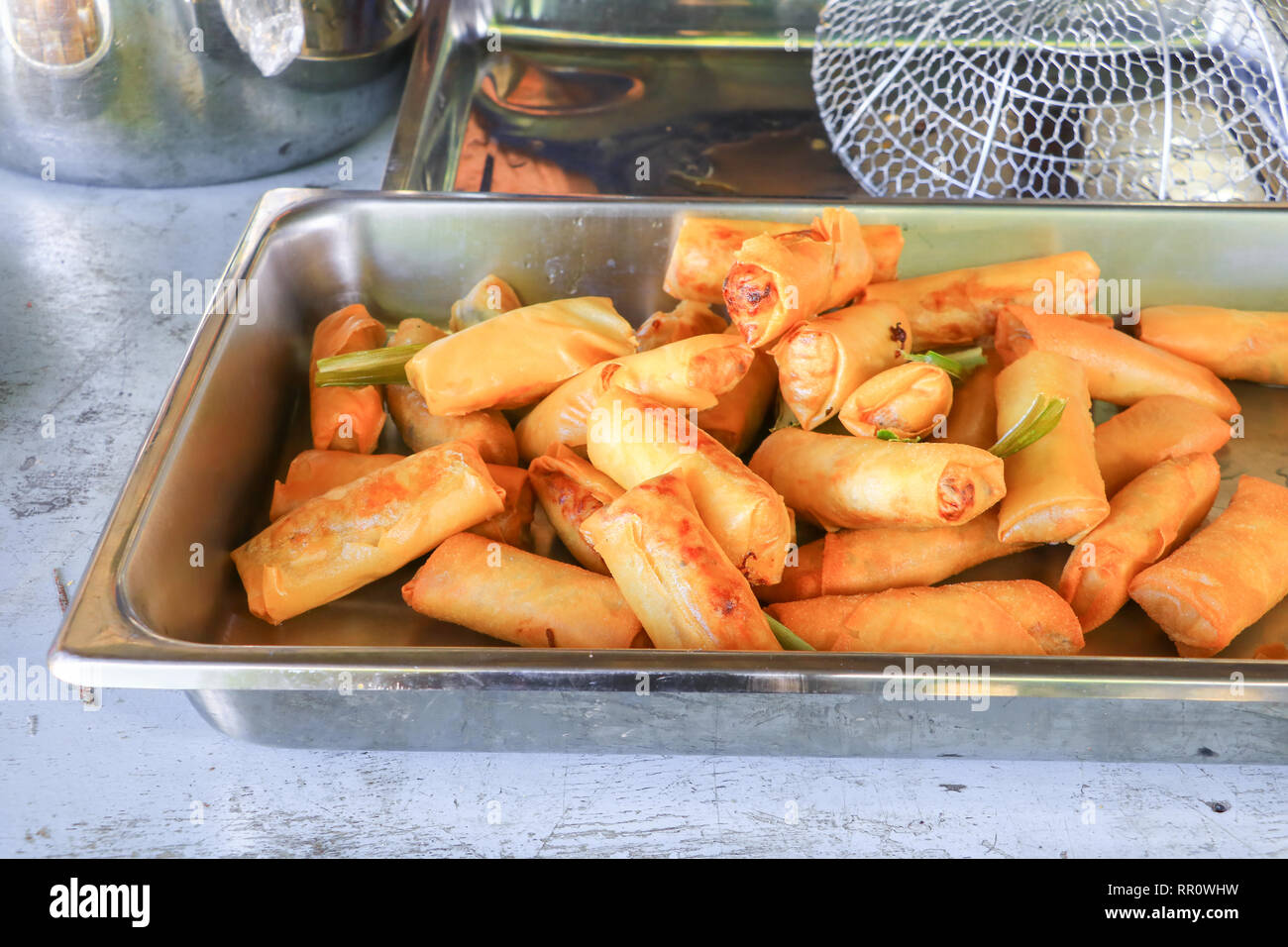 fried spring rolls In the tray on wooden table Stock Photo