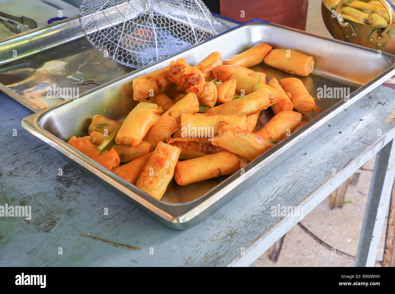 fried spring rolls In the tray on wooden table Stock Photo