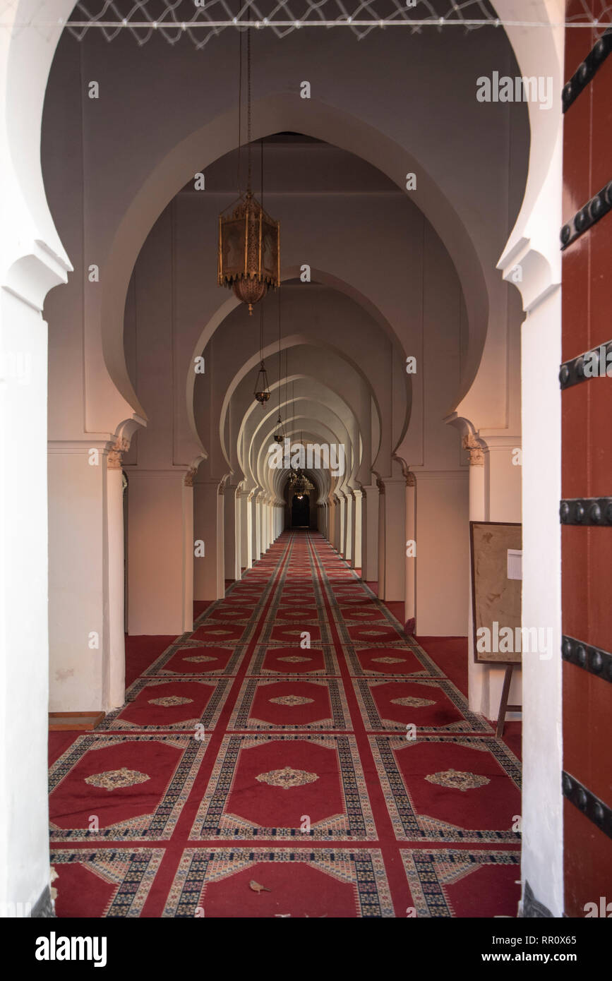 Archways in The Koutoubia Mosque or Kutubiyya Mosque and minaret located at medina quarter of Marrakech , Morocco. Inside interior arches Stock Photo