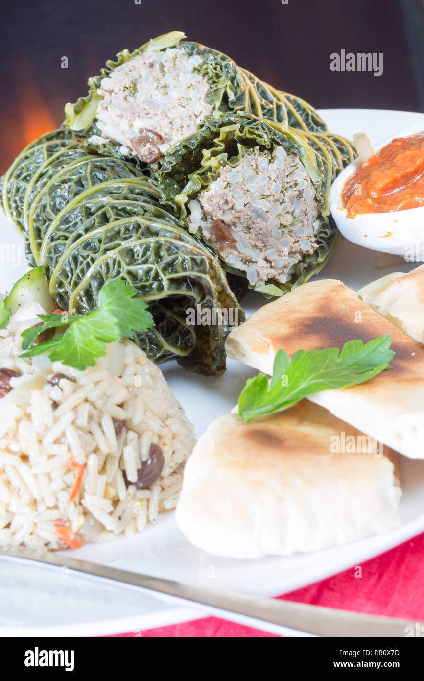 Traditional Turkish dish of stuffed cabbage leaves, Turkish dolma. Stock Photo