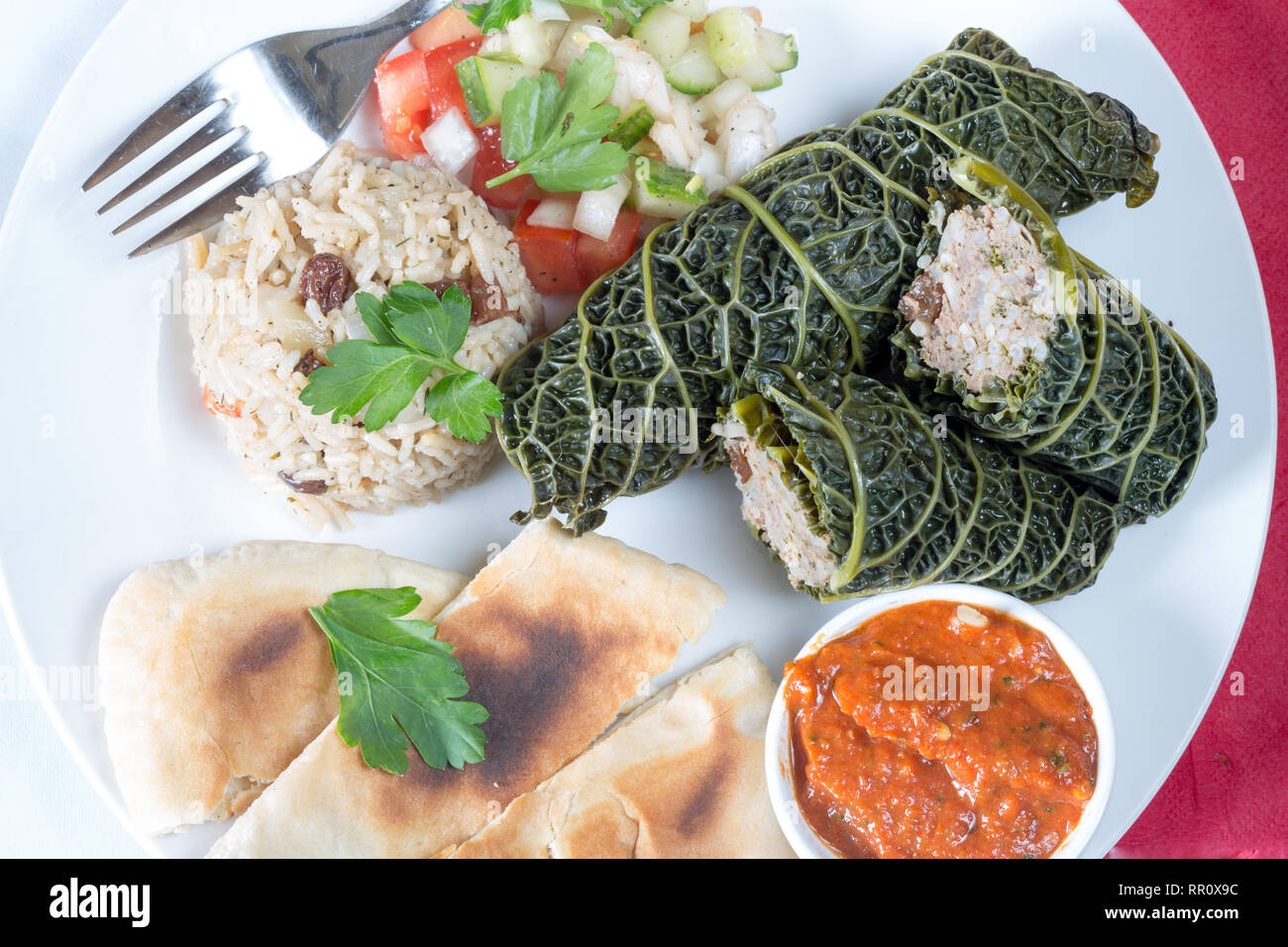 Traditional Turkish dish of stuffed cabbage leaves, Turkish dolma. Stock Photo