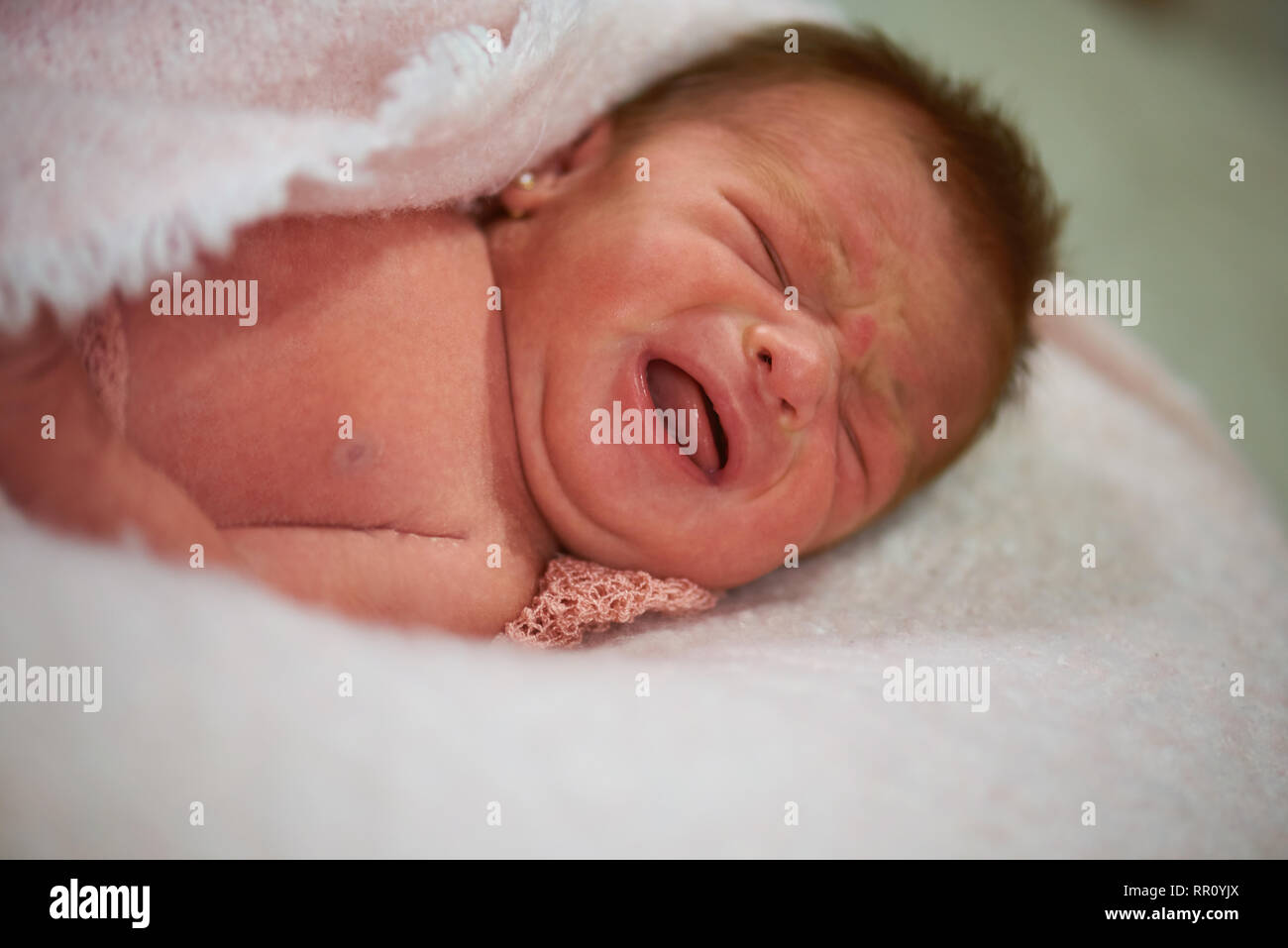 Newborn baby cry having colic close up portrait Stock Photo