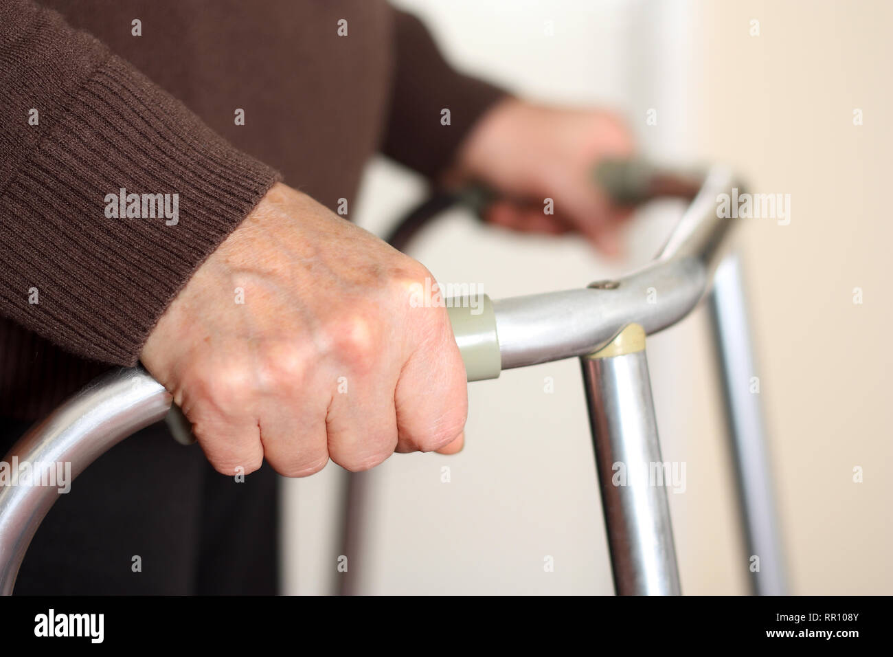 Senior using a walker Stock Photo Alamy