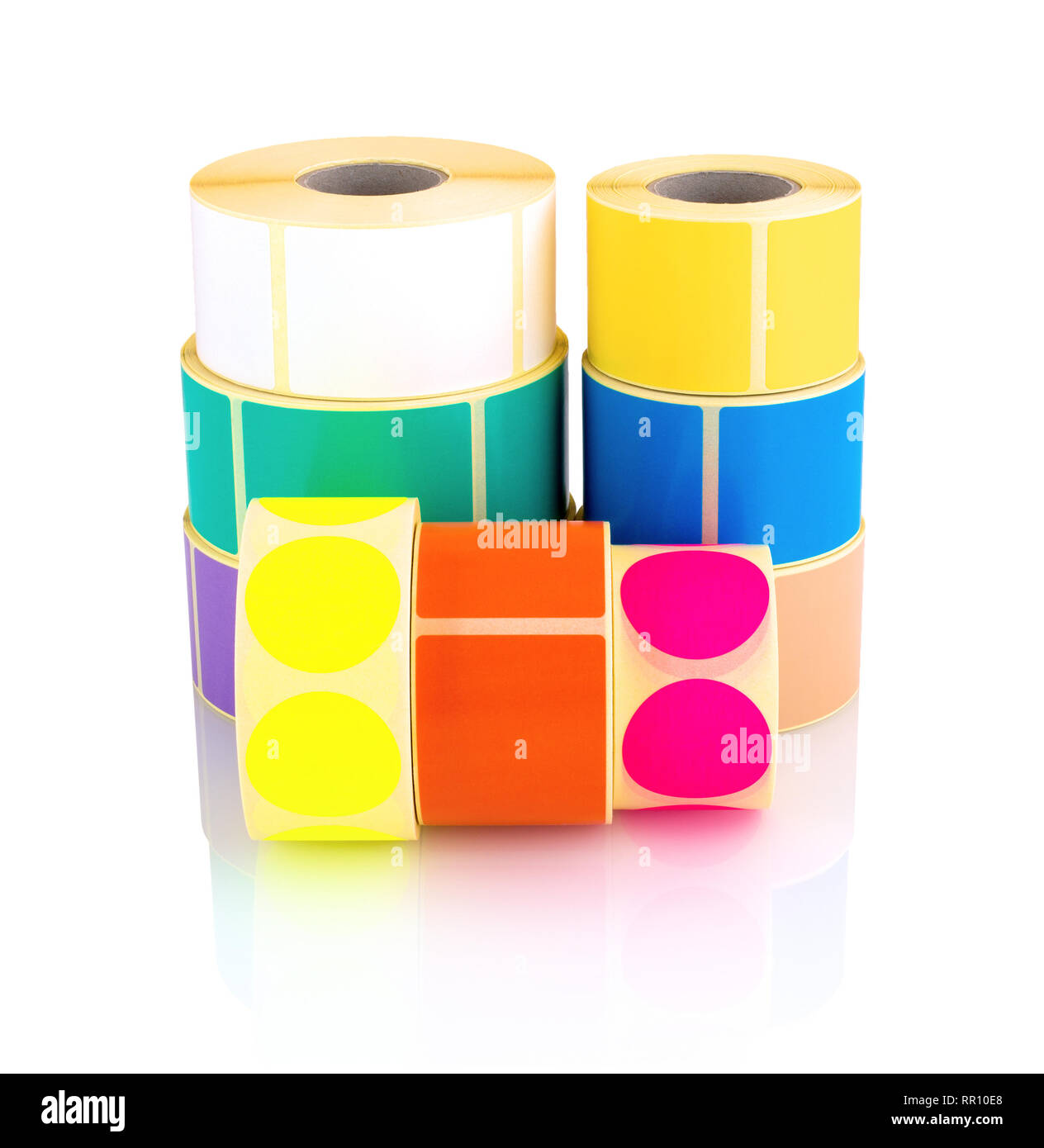 Colored label rolls isolated on white background with shadow reflection. Color reels of labels