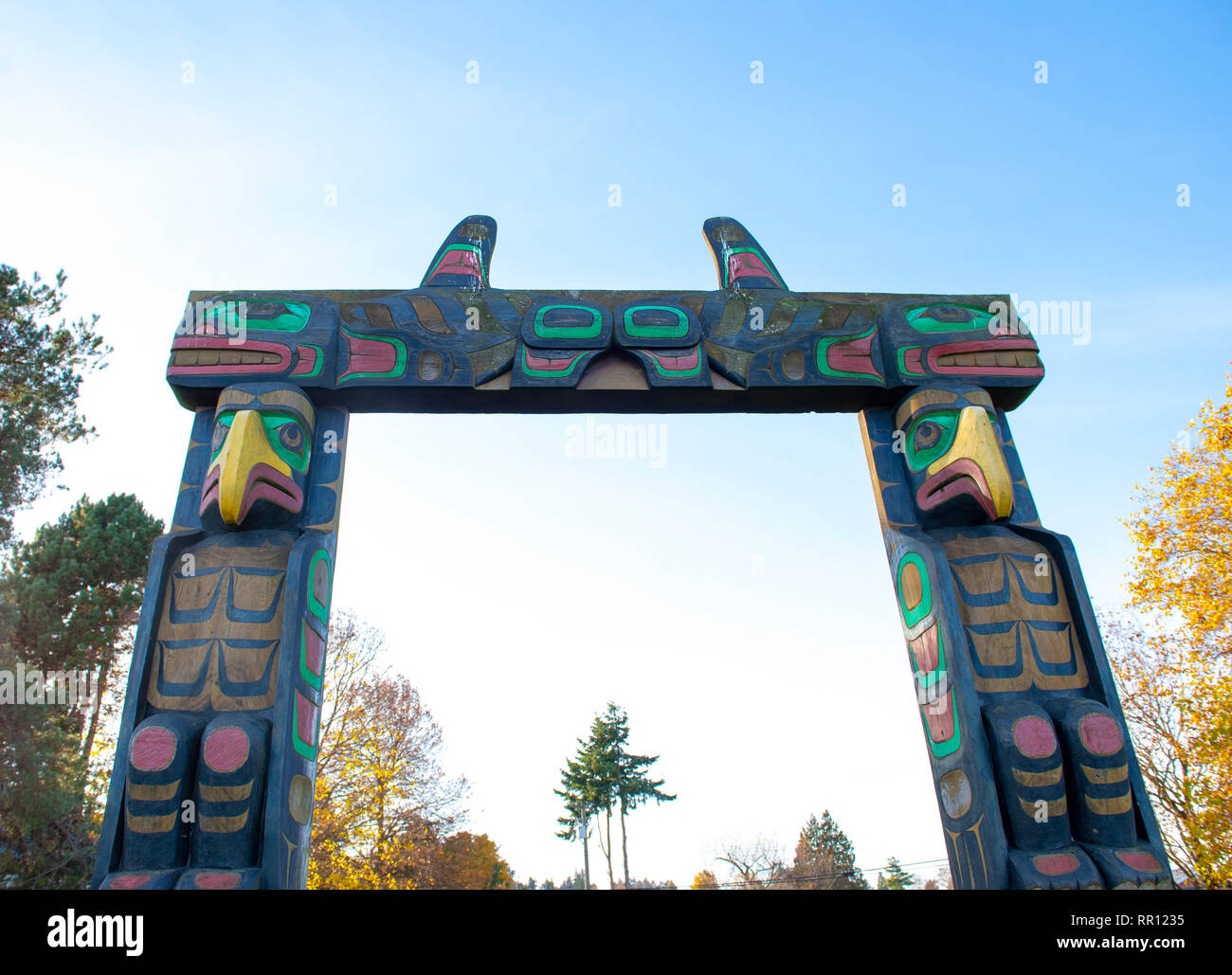 Detail of aboriginal carving totem pole arch gate in Nanaimo park, BC
