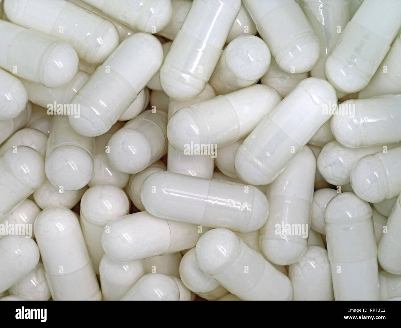 Macro of white pills background, close up Stock Photo