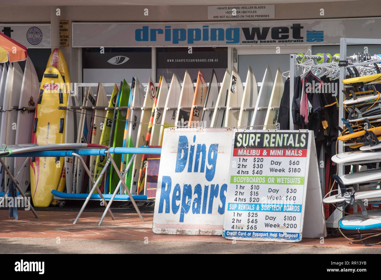 Ding repairs advertised at a surf board shop store at Sydney's Manly Beach, New South Wales, Australia Stock Photo