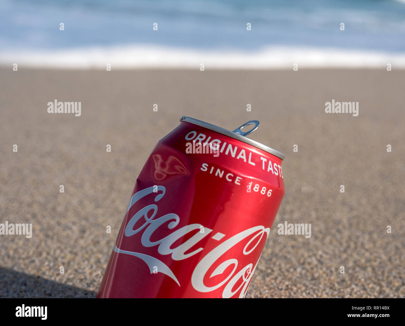 A drink of Coca - Cola on Porthmeor Surf beach St.ives Cornwall UK Europe Stock Photo