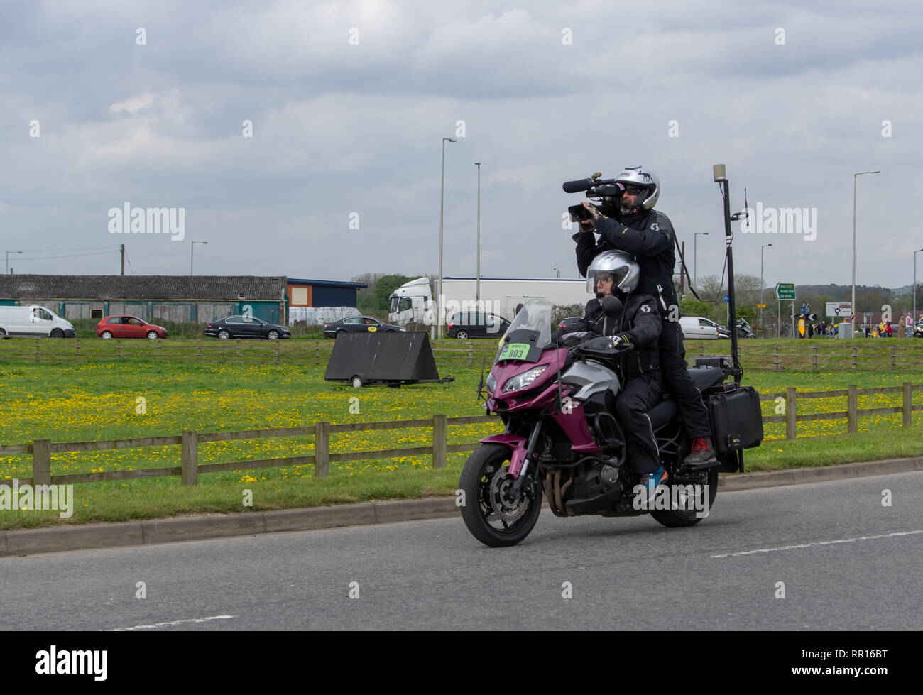 Camera man on a motor bike following the Tour de Yorkshire Stock Photo