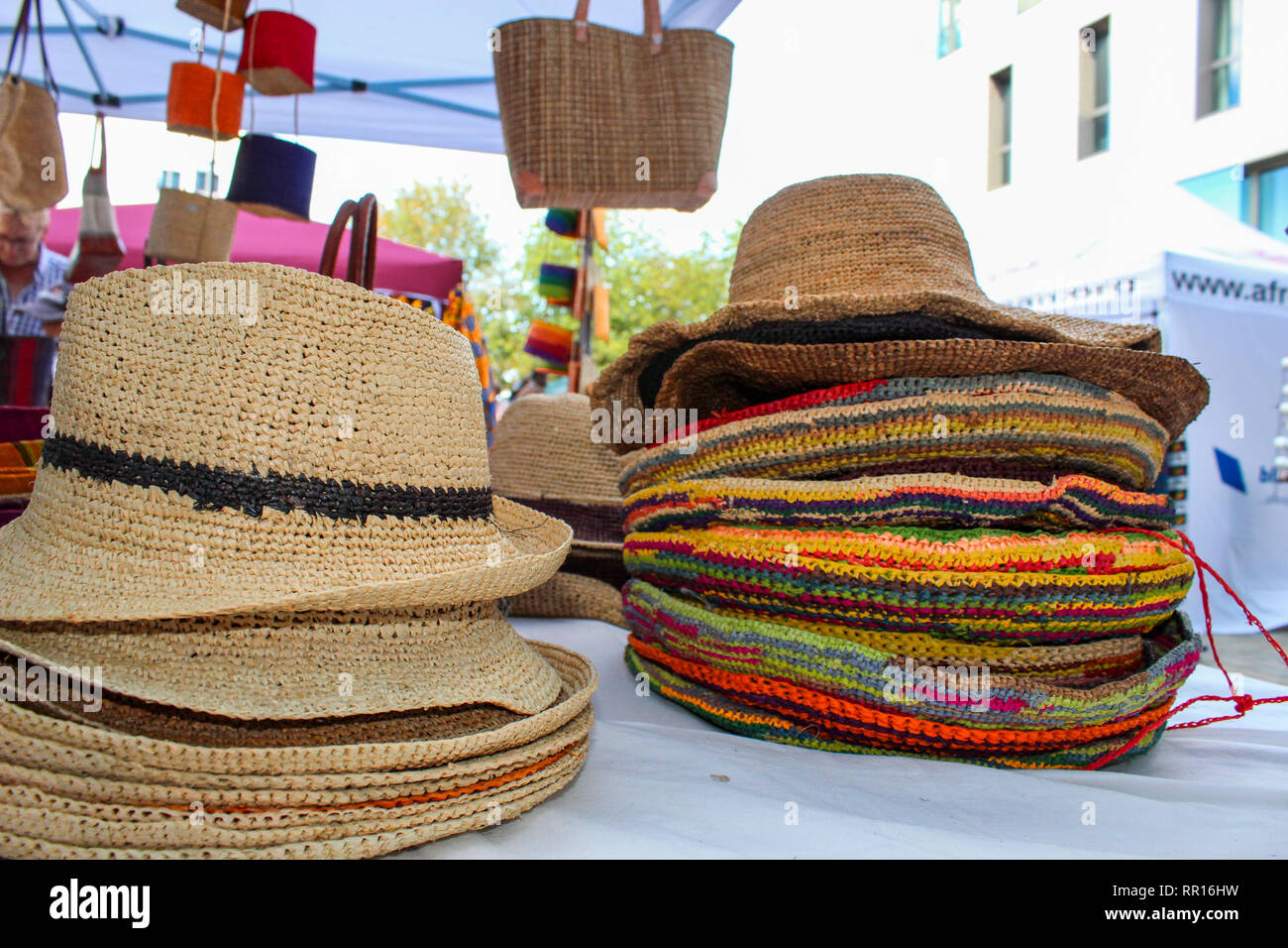Colorful straw hats and bags at a Market for sale Stock Photo - Alamy