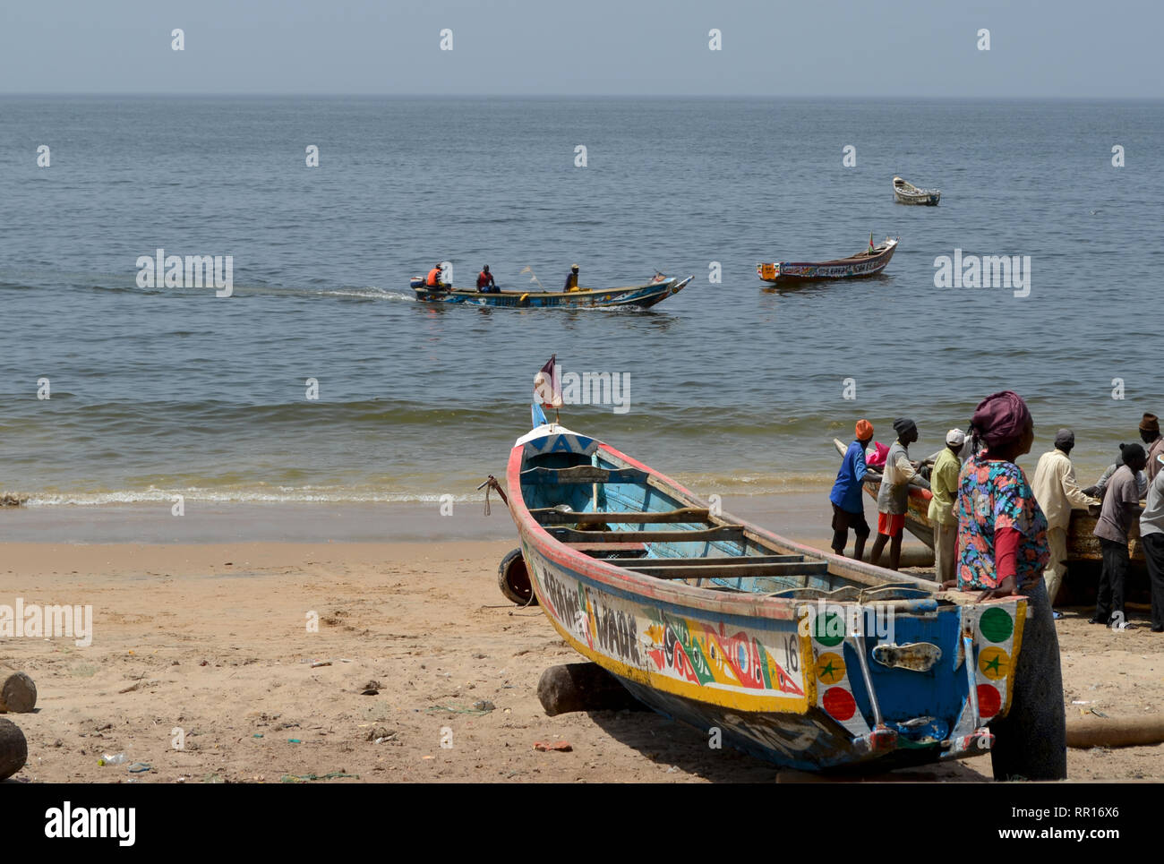 Artisanal pirogues at the beach of Djiffère, Senegal Stock Photo