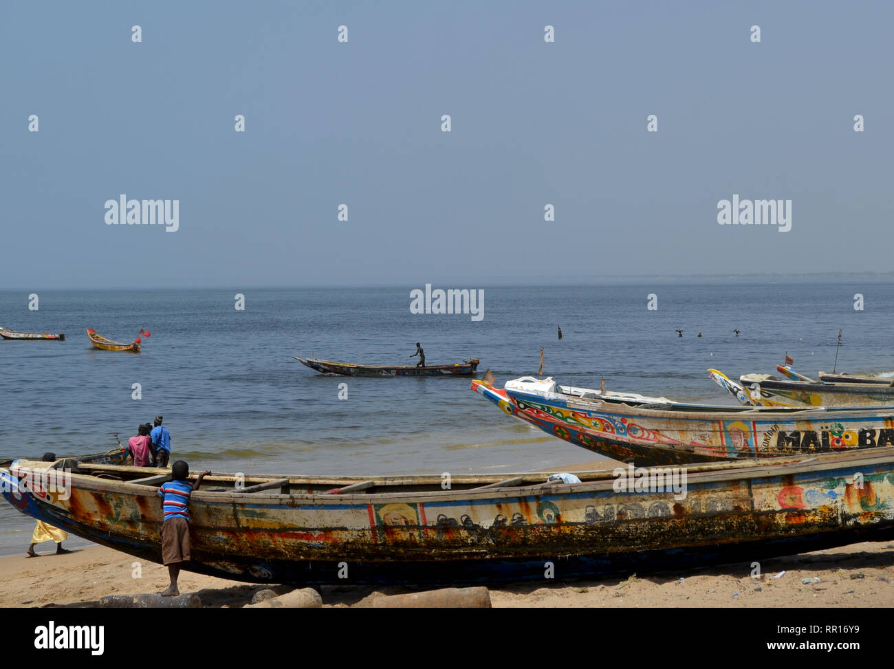 Artisanal pirogues at the beach of Djiffère, Senegal Stock Photo
