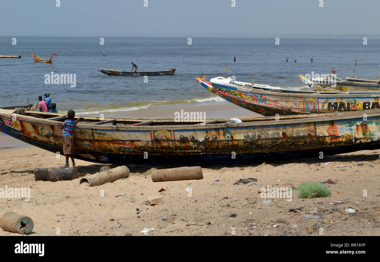 Artisanal pirogues at the beach of Djiffère, Senegal Stock Photo