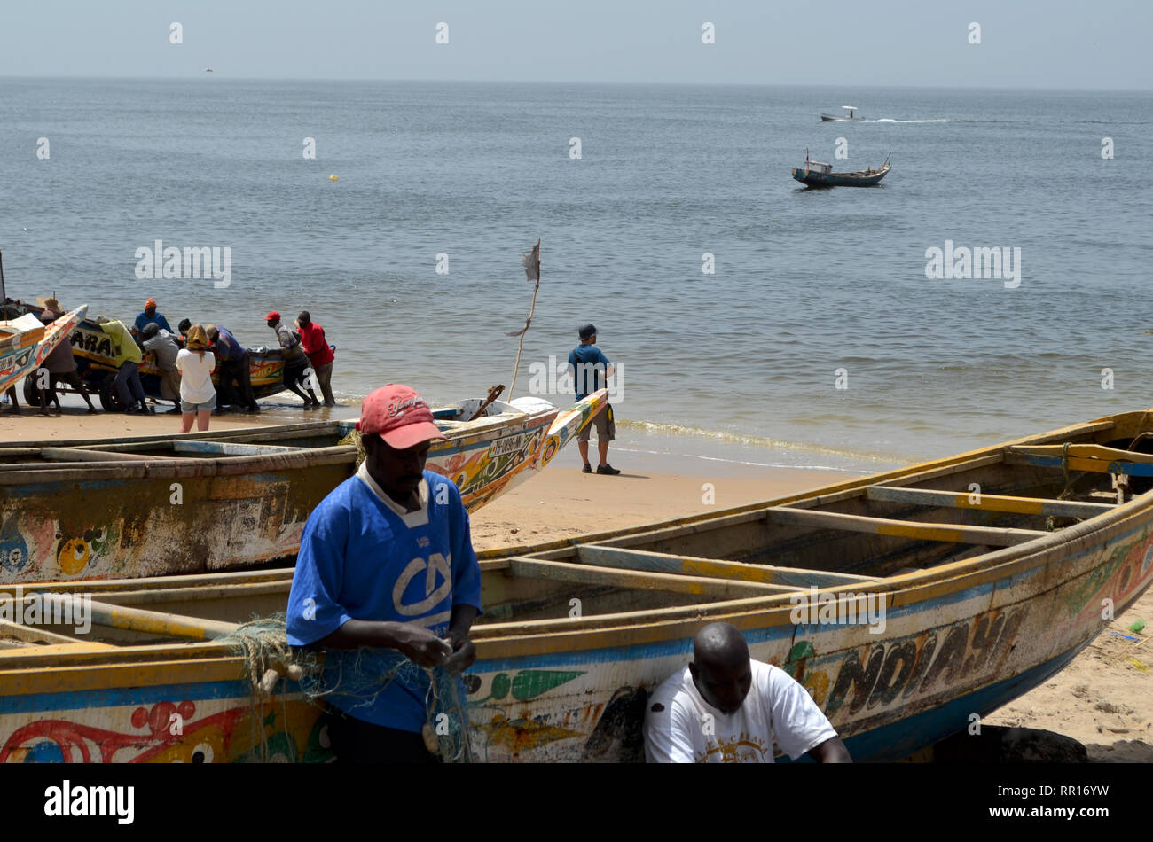 Artisanal pirogues at the beach of Djiffère, Senegal Stock Photo