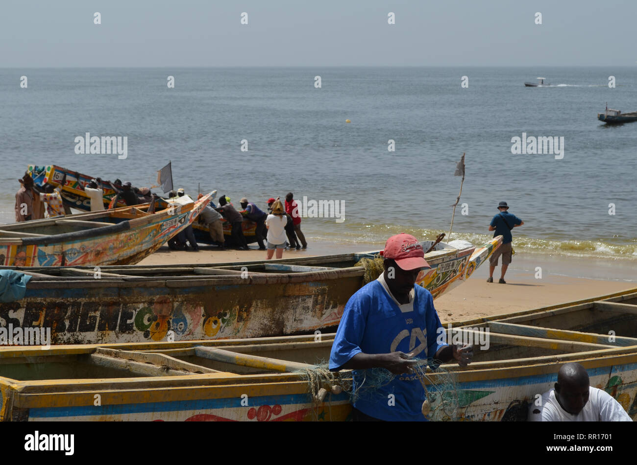 Artisanal pirogues at the beach of Djiffère, Senegal Stock Photo
