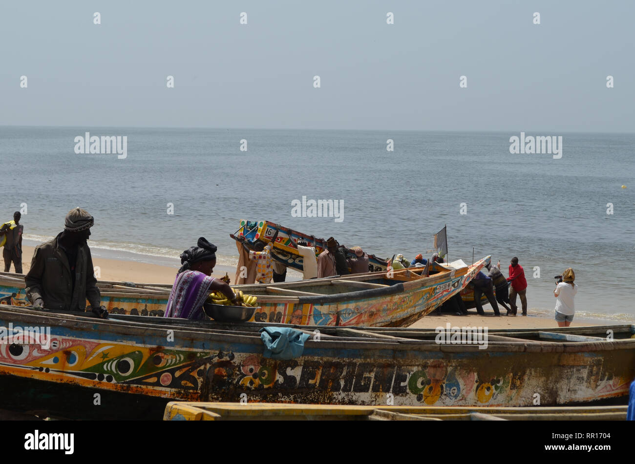 Artisanal pirogues at the beach of Djiffère, Senegal Stock Photo