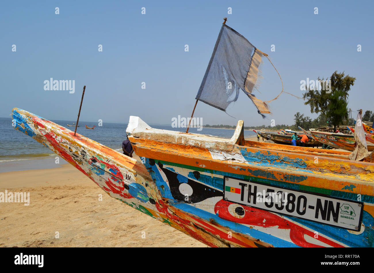 Artisanal pirogues at the beach of Djiffère, Senegal Stock Photo