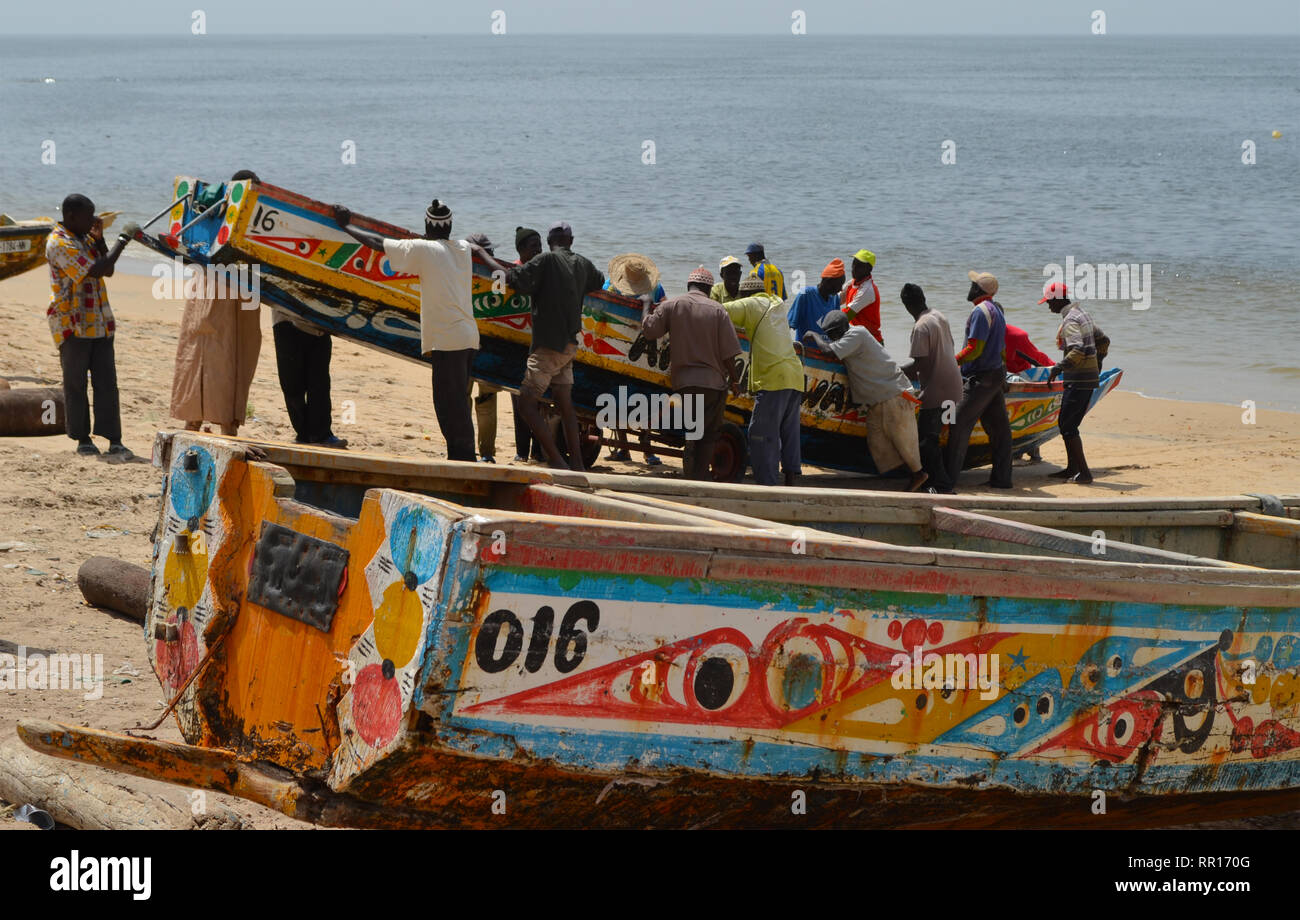 Artisanal pirogues at the beach of Djiffère, Senegal Stock Photo