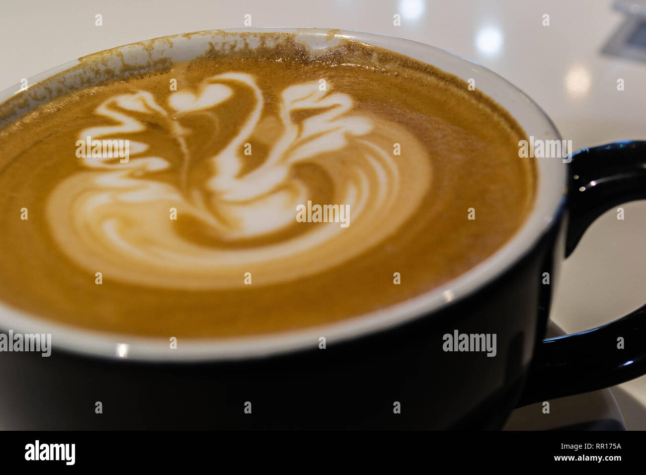 Close up of a foamy latte at an espresso bar Stock Photo Alamy