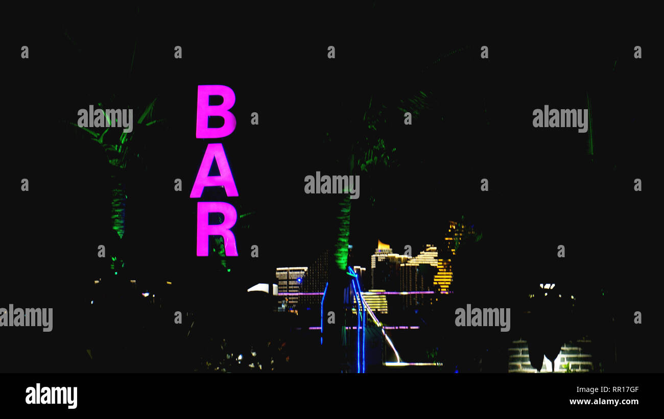 Pink neon sign of the word Bar on a black background Stock Photo Alamy